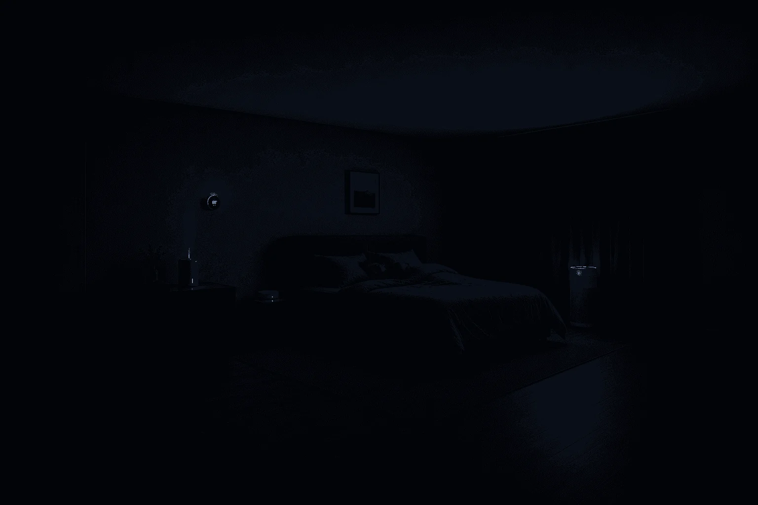A darkened bedroom at night with the Alora sensor glowing faintly.